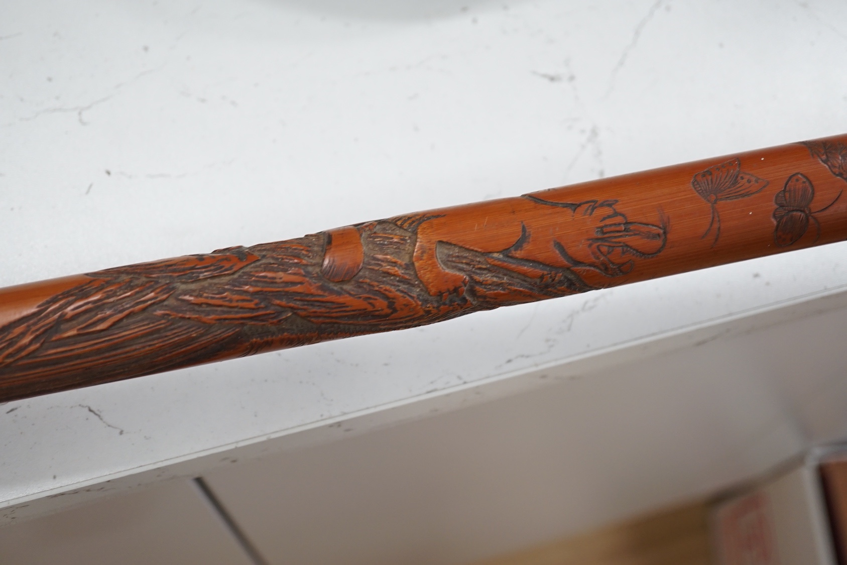 A Japanese carved bamboo walking stick, 89cm